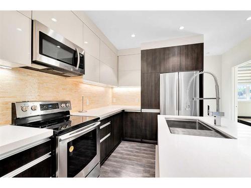 203-108 13 Avenue Ne, Calgary, AB - Indoor Photo Showing Kitchen With Stainless Steel Kitchen With Upgraded Kitchen