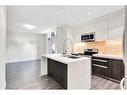 203-108 13 Avenue Ne, Calgary, AB  - Indoor Photo Showing Kitchen With Double Sink With Upgraded Kitchen 