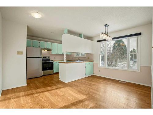 2408 26 Street, Nanton, AB - Indoor Photo Showing Kitchen