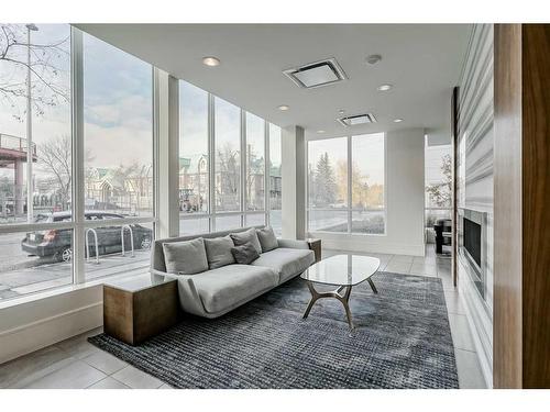 307-128 2 Street Sw, Calgary, AB - Indoor Photo Showing Other Room With Fireplace