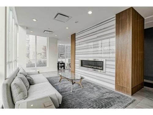 307-128 2 Street Sw, Calgary, AB - Indoor Photo Showing Living Room With Fireplace