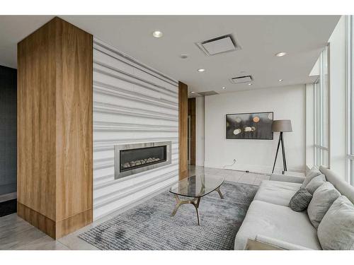 307-128 2 Street Sw, Calgary, AB - Indoor Photo Showing Living Room With Fireplace