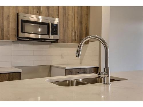 269 Royal Elm Road Nw, Calgary, AB - Indoor Photo Showing Kitchen With Double Sink