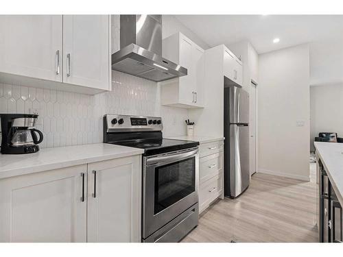 443 South Point Lane Sw, Airdrie, AB - Indoor Photo Showing Kitchen With Stainless Steel Kitchen