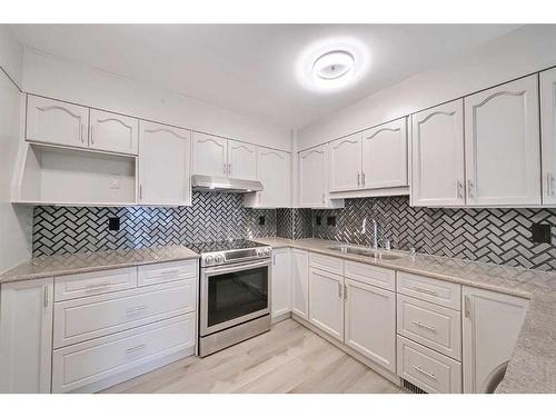 56 Riverview Drive Se, Calgary, AB - Indoor Photo Showing Kitchen With Double Sink