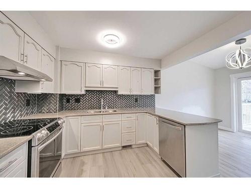 56 Riverview Drive Se, Calgary, AB - Indoor Photo Showing Kitchen With Double Sink