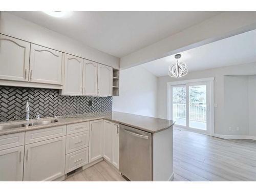 56 Riverview Drive Se, Calgary, AB - Indoor Photo Showing Kitchen With Double Sink