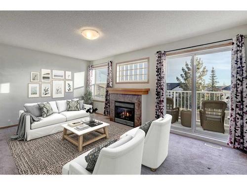 39 Covemeadow Manor Ne, Calgary, AB - Indoor Photo Showing Living Room With Fireplace