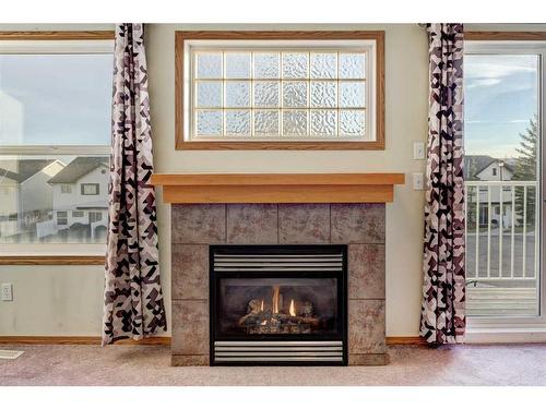 39 Covemeadow Manor Ne, Calgary, AB - Indoor Photo Showing Living Room With Fireplace