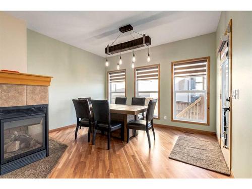 66 Kincora Glen Rise Nw, Calgary, AB - Indoor Photo Showing Dining Room With Fireplace