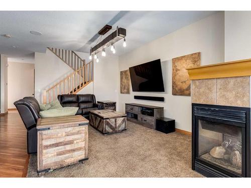 66 Kincora Glen Rise Nw, Calgary, AB - Indoor Photo Showing Living Room With Fireplace