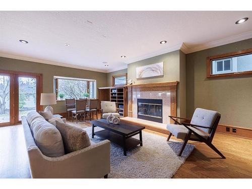 311 Roxboro Road Sw, Calgary, AB - Indoor Photo Showing Living Room With Fireplace