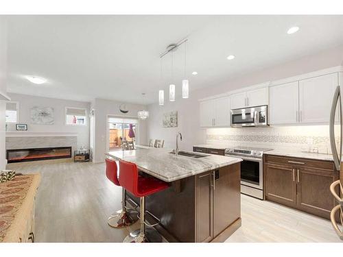 341 Ravenstern Link Se, Airdrie, AB - Indoor Photo Showing Kitchen With Stainless Steel Kitchen With Double Sink With Upgraded Kitchen