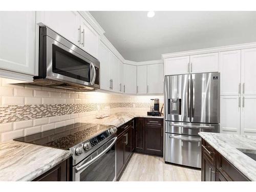 341 Ravenstern Link Se, Airdrie, AB - Indoor Photo Showing Kitchen With Stainless Steel Kitchen With Upgraded Kitchen