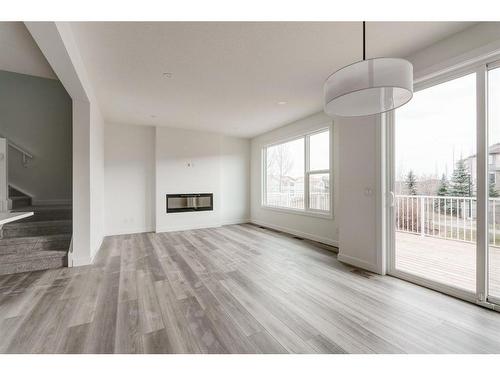 211 Silver Spruce Grove Sw, Calgary, AB - Indoor With Fireplace