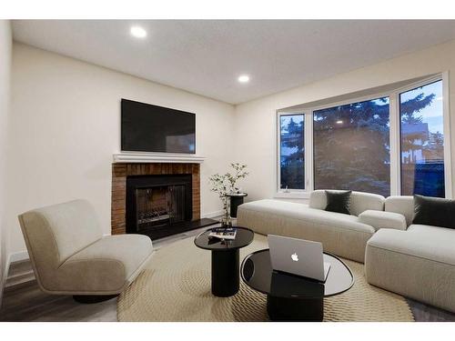 56 Woodview Court Sw, Calgary, AB - Indoor Photo Showing Living Room With Fireplace