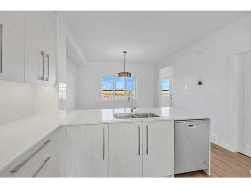 612 Dawson Drive, Chestermere, AB - Indoor Photo Showing Kitchen With Double Sink