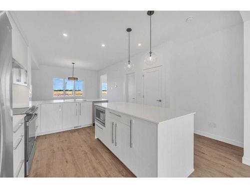 612 Dawson Drive, Chestermere, AB - Indoor Photo Showing Kitchen With Upgraded Kitchen