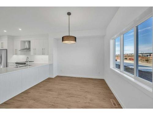 612 Dawson Drive, Chestermere, AB - Indoor Photo Showing Kitchen With Double Sink