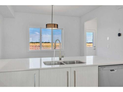 612 Dawson Drive, Chestermere, AB - Indoor Photo Showing Kitchen With Double Sink