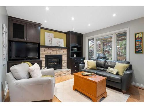 71 Edcath Road Nw, Calgary, AB - Indoor Photo Showing Living Room With Fireplace