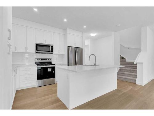 2051 Fowler Road Sw, Airdrie, AB - Indoor Photo Showing Kitchen With Stainless Steel Kitchen With Upgraded Kitchen