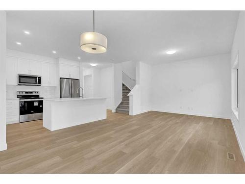 2051 Fowler Road Sw, Airdrie, AB - Indoor Photo Showing Kitchen With Upgraded Kitchen