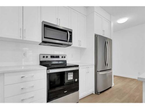 2051 Fowler Road Sw, Airdrie, AB - Indoor Photo Showing Kitchen With Stainless Steel Kitchen With Upgraded Kitchen