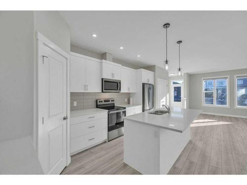 1131 Chinook Winds Circle Sw, Airdrie, AB - Indoor Photo Showing Kitchen With Stainless Steel Kitchen With Double Sink With Upgraded Kitchen