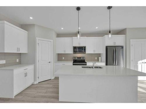 1131 Chinook Winds Circle Sw, Airdrie, AB - Indoor Photo Showing Kitchen With Stainless Steel Kitchen With Double Sink With Upgraded Kitchen