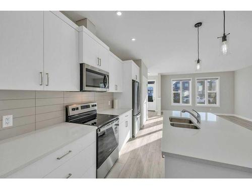 1131 Chinook Winds Circle Sw, Airdrie, AB - Indoor Photo Showing Kitchen With Stainless Steel Kitchen With Double Sink With Upgraded Kitchen