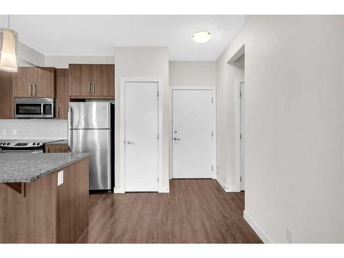 108-8 Sage Hill Terrace Nw, Calgary, AB - Indoor Photo Showing Kitchen With Stainless Steel Kitchen