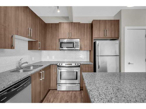 108-8 Sage Hill Terrace Nw, Calgary, AB - Indoor Photo Showing Kitchen With Stainless Steel Kitchen With Double Sink With Upgraded Kitchen