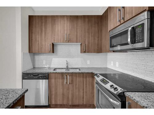 108-8 Sage Hill Terrace Nw, Calgary, AB - Indoor Photo Showing Kitchen With Stainless Steel Kitchen With Double Sink