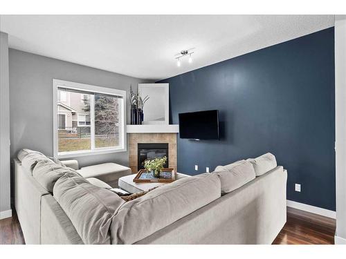 72-300 Marina Drive, Chestermere, AB - Indoor Photo Showing Living Room With Fireplace