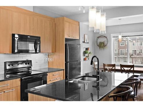 72-300 Marina Drive, Chestermere, AB - Indoor Photo Showing Kitchen With Double Sink