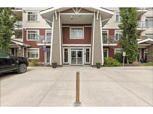 210-22 Auburn Bay Link Se, Calgary, AB - Outdoor With Balcony With Facade