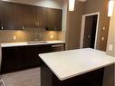 210-22 Auburn Bay Link Se, Calgary, AB  - Indoor Photo Showing Kitchen With Double Sink 