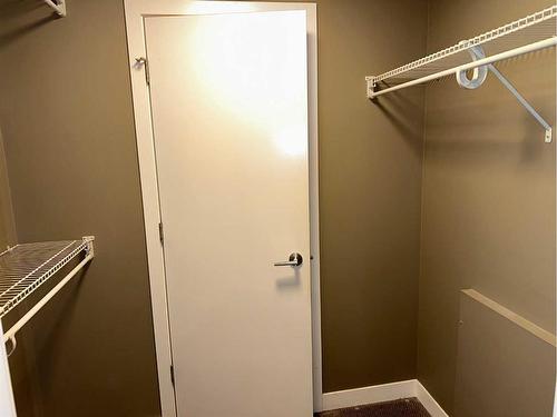 210-22 Auburn Bay Link Se, Calgary, AB - Indoor With Storage