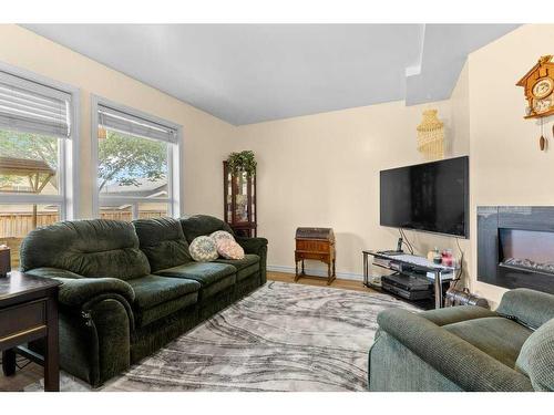 15-900 Allen Street Se, Airdrie, AB - Indoor Photo Showing Living Room With Fireplace