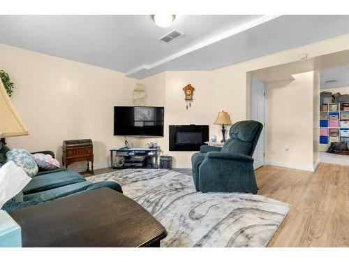 15-900 Allen Street Se, Airdrie, AB - Indoor Photo Showing Living Room With Fireplace