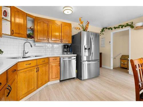 15-900 Allen Street Se, Airdrie, AB - Indoor Photo Showing Kitchen With Double Sink