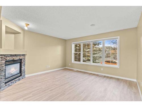 32 Panora Close Nw, Calgary, AB - Indoor Photo Showing Living Room With Fireplace