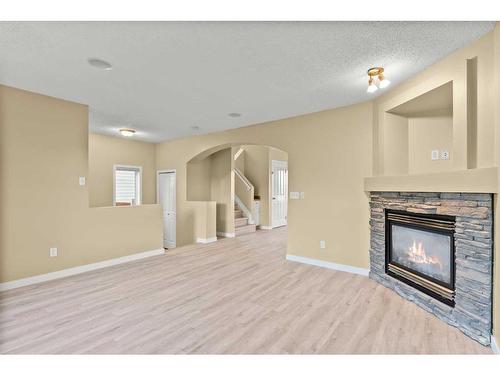 32 Panora Close Nw, Calgary, AB - Indoor Photo Showing Living Room With Fireplace