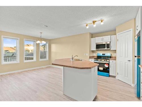 32 Panora Close Nw, Calgary, AB - Indoor Photo Showing Kitchen With Double Sink