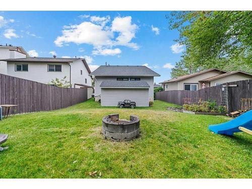 52 Hawkcliff Way Nw, Calgary, AB - Outdoor With Backyard With Exterior