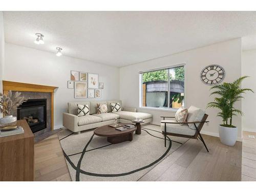 10 Tuscany Meadows Drive Nw, Calgary, AB - Indoor Photo Showing Living Room With Fireplace