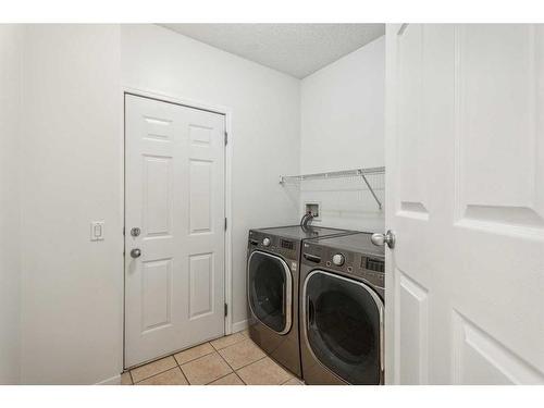 10 Tuscany Meadows Drive Nw, Calgary, AB - Indoor Photo Showing Laundry Room