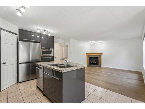 10 Tuscany Meadows Drive Nw, Calgary, AB - Indoor Photo Showing Kitchen With Double Sink