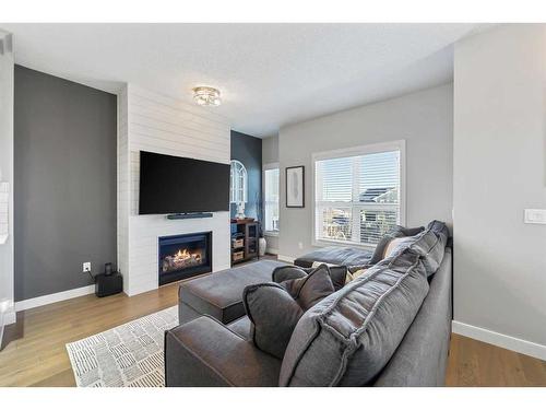 104 Silverado Plains Park Sw, Calgary, AB - Indoor Photo Showing Living Room With Fireplace